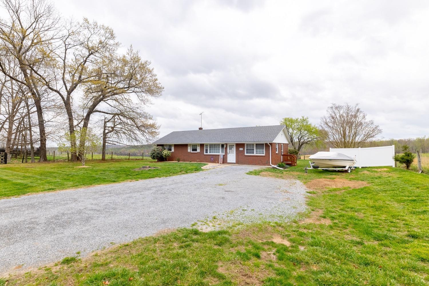 4100 Roark Mill Road Hurt, VA 24563 - Photo 25 of 42 a view of a house with a big yard and large trees
