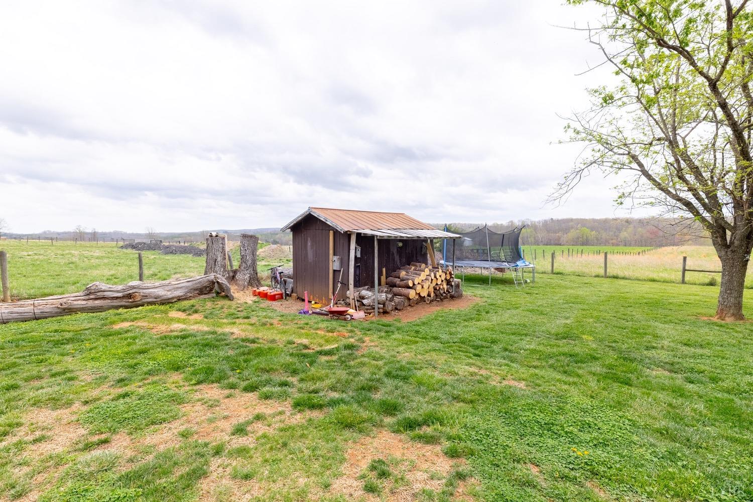 4100 Roark Mill Road Hurt, VA 24563 - Photo 32 of 42 a view of a house with backyard sitting area and garden