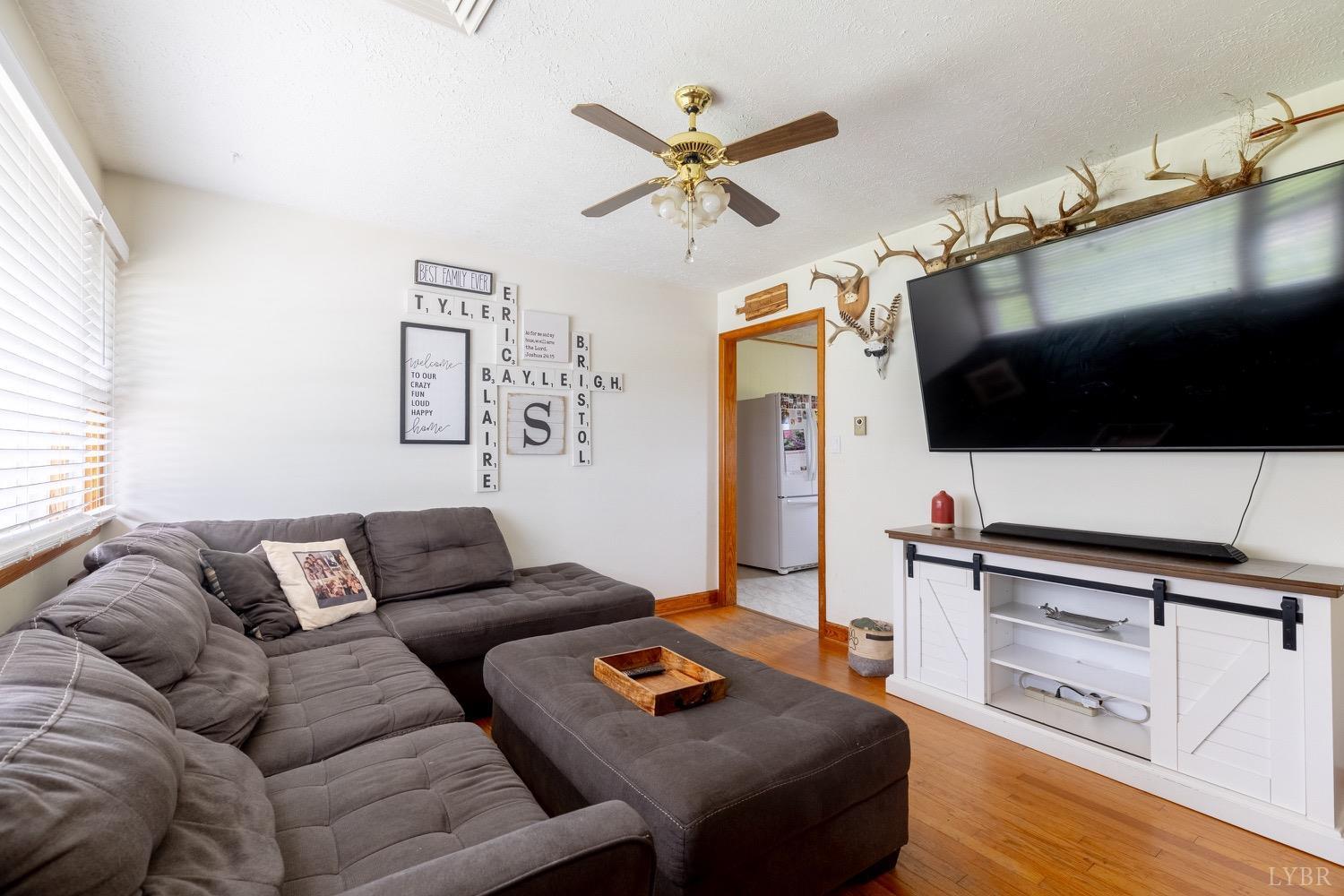 4100 Roark Mill Road Hurt, VA 24563 - Photo 4 of 42 a living room with furniture and a flat screen tv