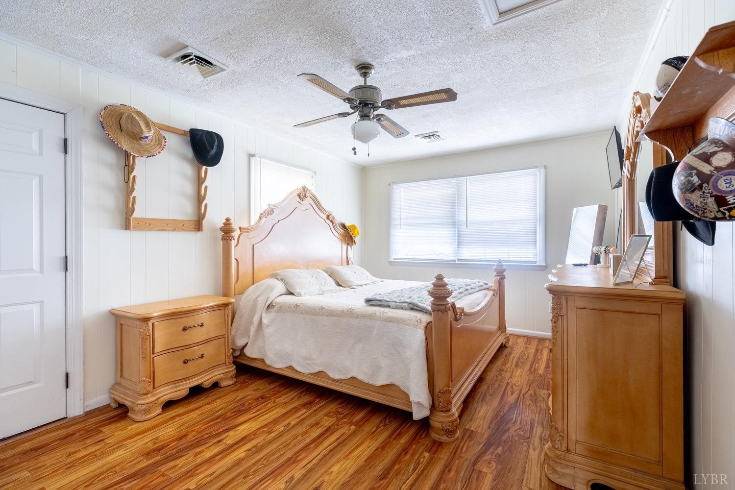 4100 Roark Mill Road Hurt, VA 24563 - Photo 9 of 42 a bedroom with a bed and wooden floor