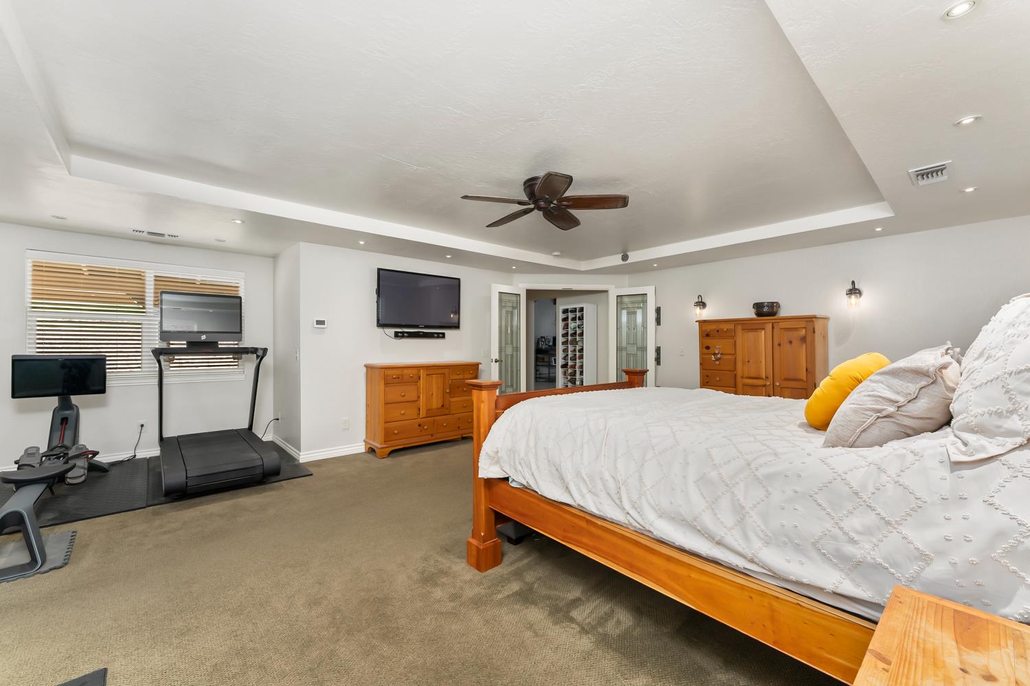 5990 Upper Ridge Way Auburn, CA 95602 - Photo 19 of 51 a bedroom with a bed couch tv and a window