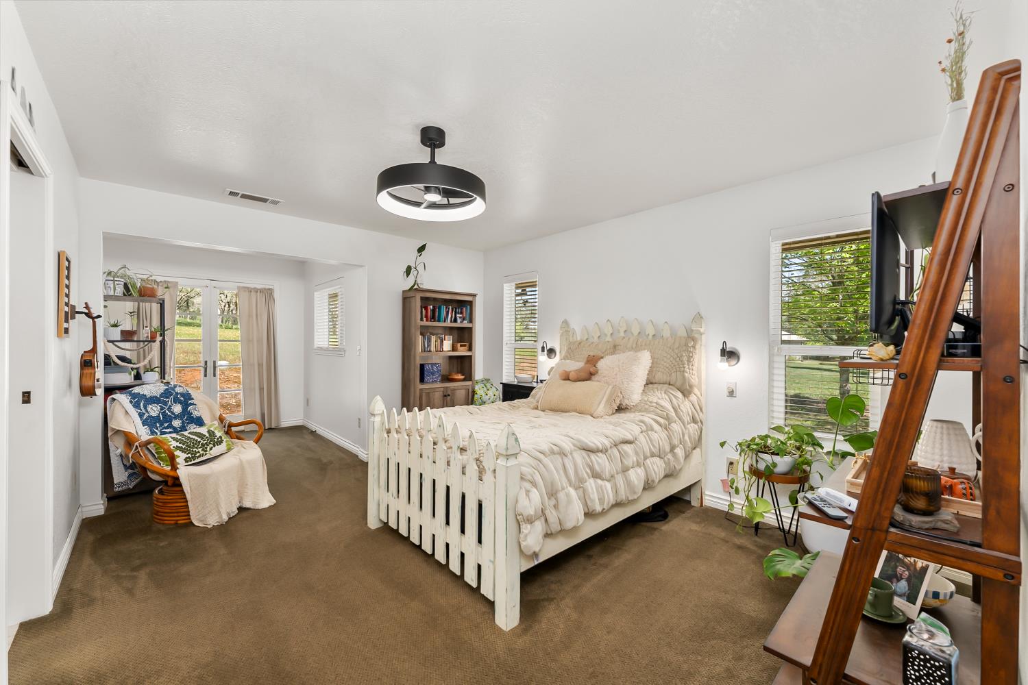 5990 Upper Ridge Way Auburn, CA 95602 - Photo 22 of 51 a bedroom with a bed and a large window