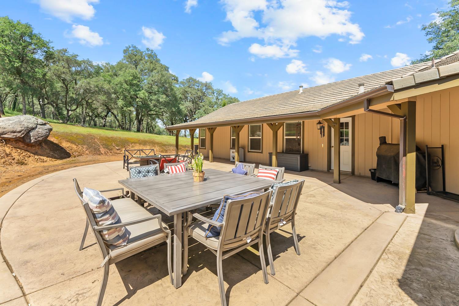 5990 Upper Ridge Way Auburn, CA 95602 - Photo 35 of 51 a dinning table and chairs in the patio
