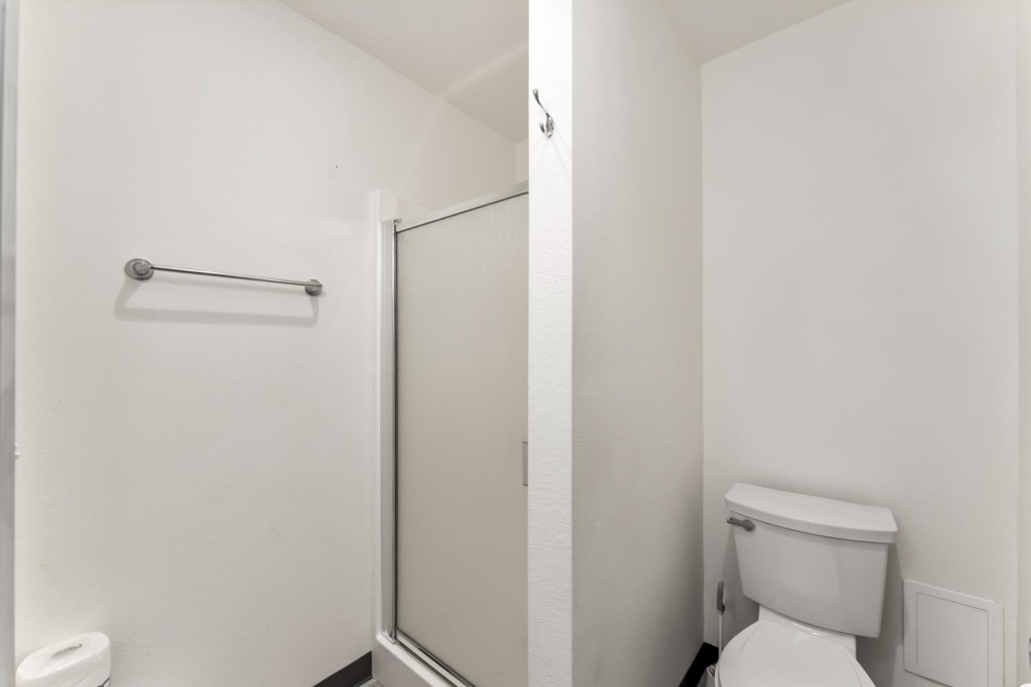 5990 Upper Ridge Way Auburn, CA 95602 - Photo 47 of 51 a white toilet sitting next to a shower