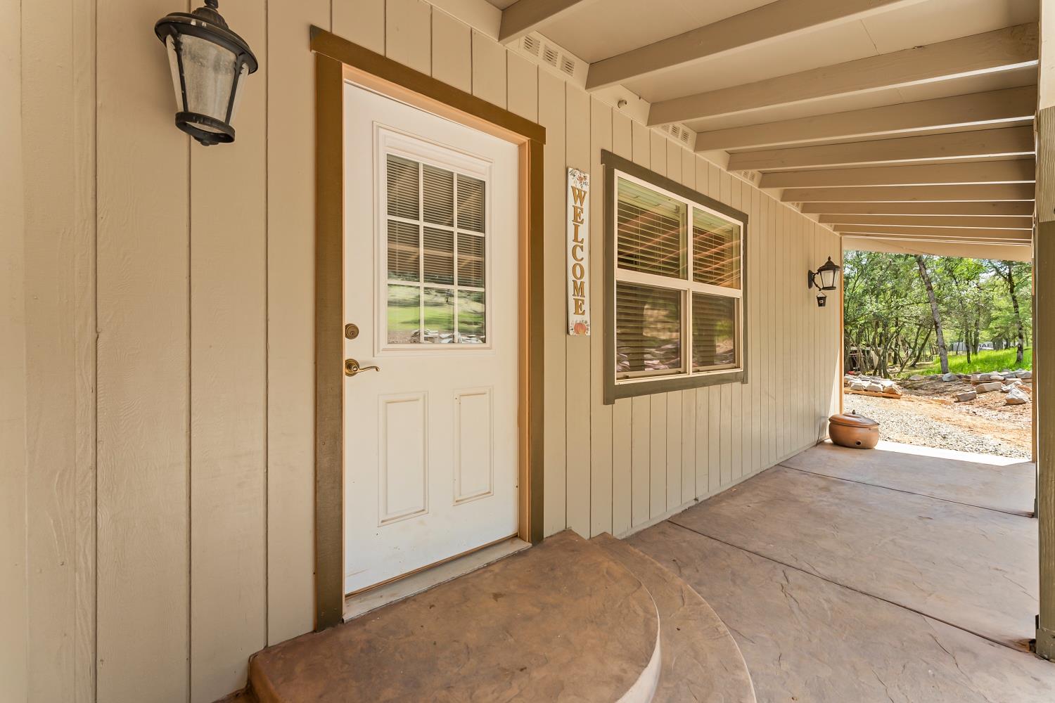 5990 Upper Ridge Way Auburn, CA 95602 - Photo 7 of 51 a view of a house with a door and a window