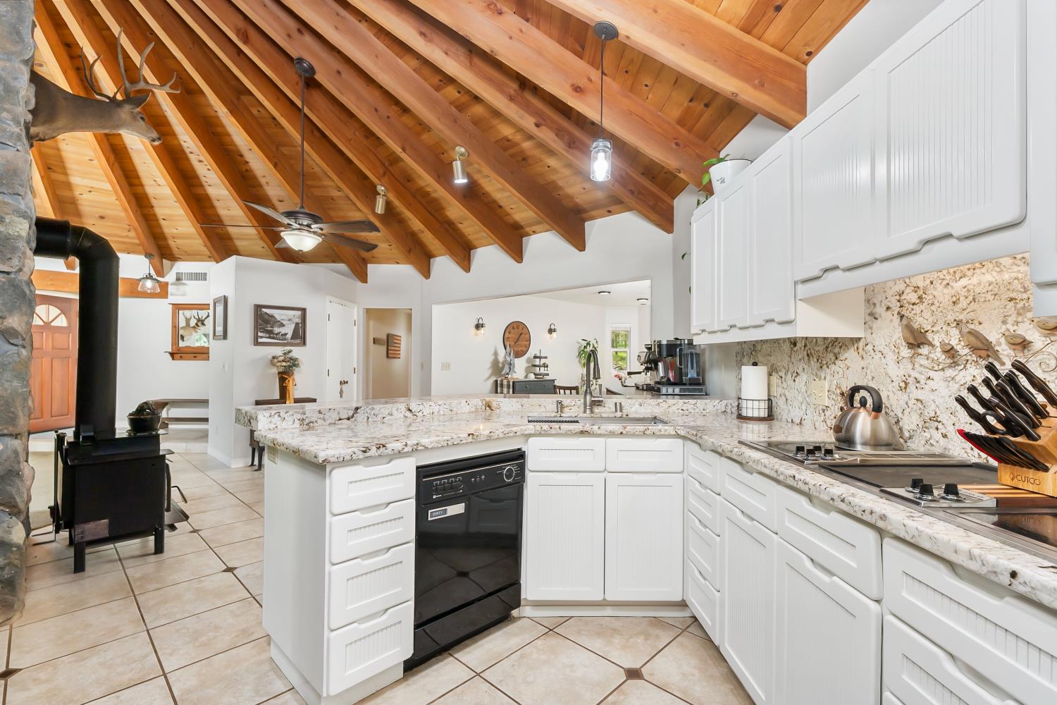 5990 Upper Ridge Way Auburn, CA 95602 - Photo 10 of 51 a kitchen with a sink dishwasher and cabinets