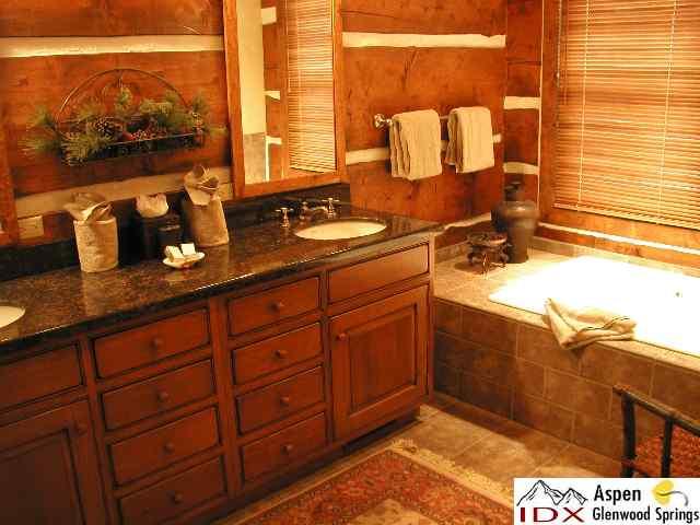 38 Altamira Ranch Road, Unit 1/4 FRANCTIONAL INTEREST Basalt, CO 81621 - Photo 8 of 9 a bathroom with a sink and a mirror