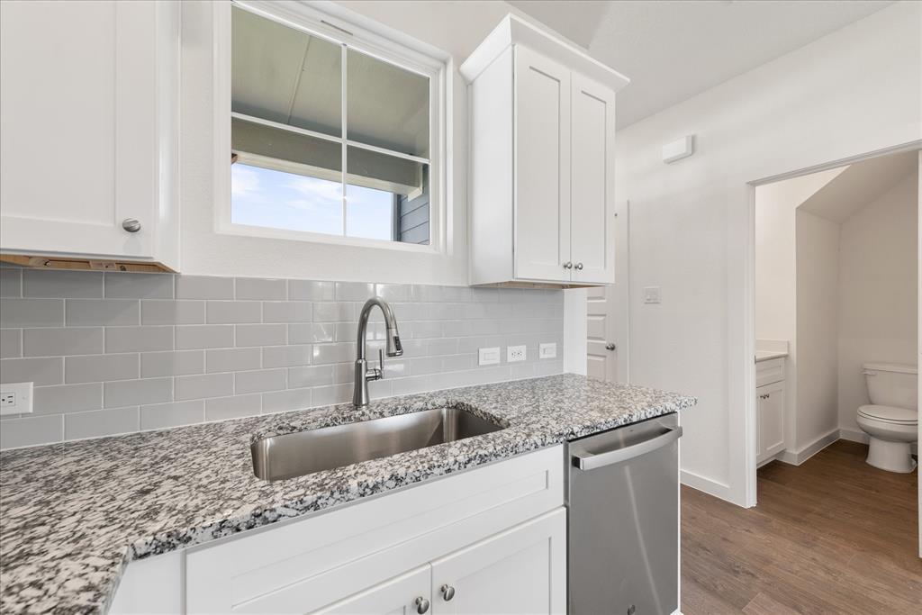 1210 Chestnut Court, Unit 1 Runaway Bay, TX 76426 - Photo 11 of 29 a kitchen with a sink and cabinets