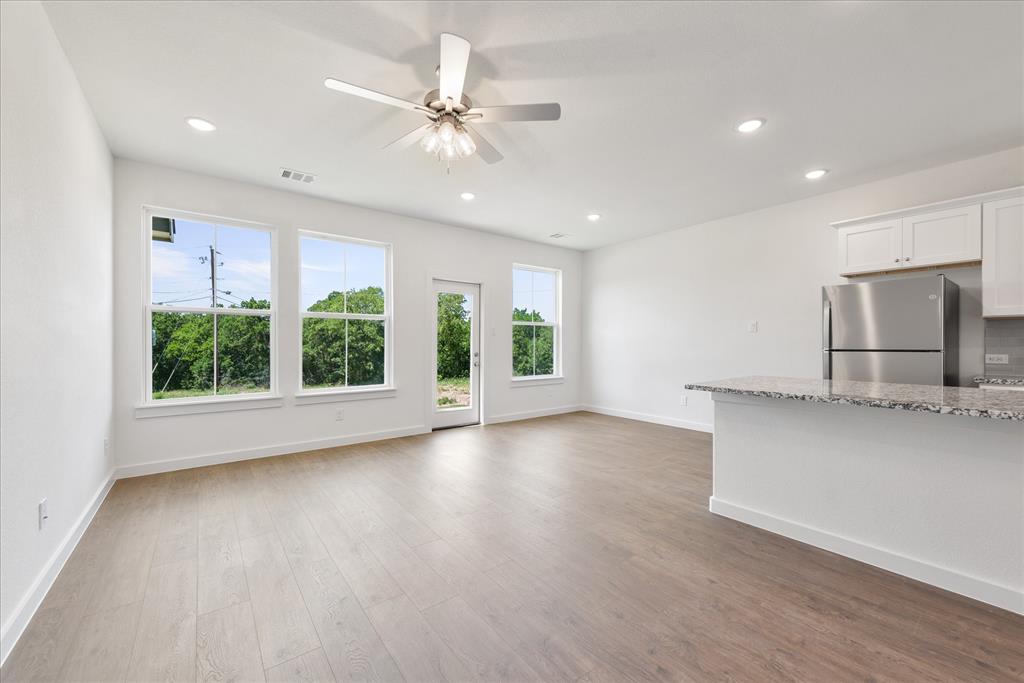 1210 Chestnut Court, Unit 1 Runaway Bay, TX 76426 - Photo 15 of 29 a view of a kitchen with a sink and microwave