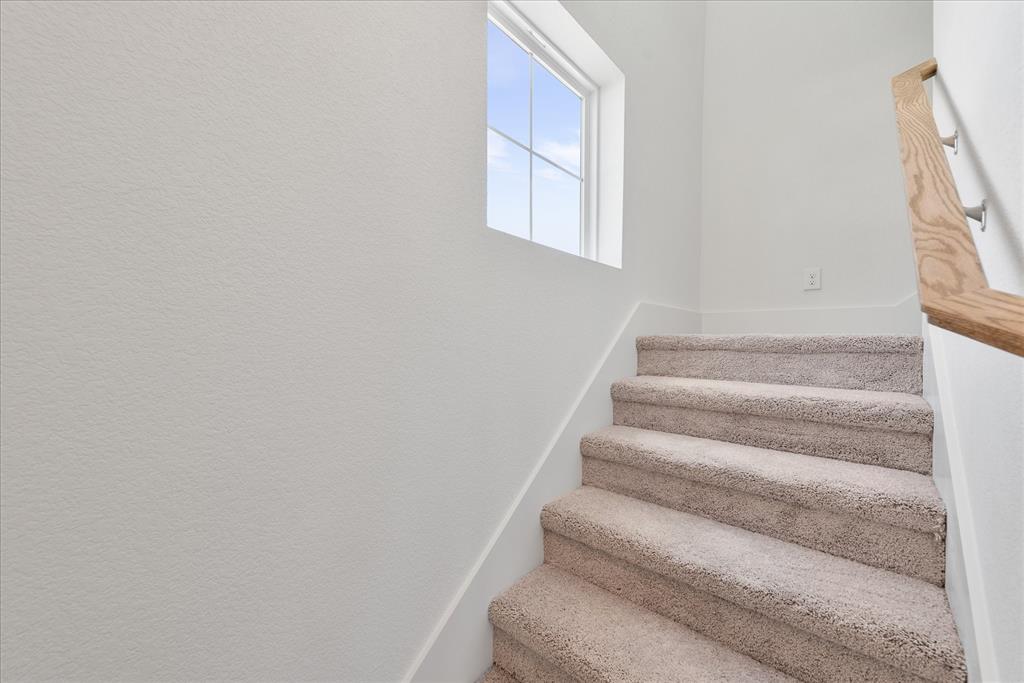 1210 Chestnut Court, Unit 1 Runaway Bay, TX 76426 - Photo 19 of 29 a view of staircase with white walls