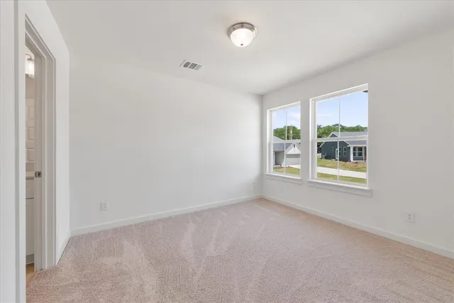 an empty room with windows