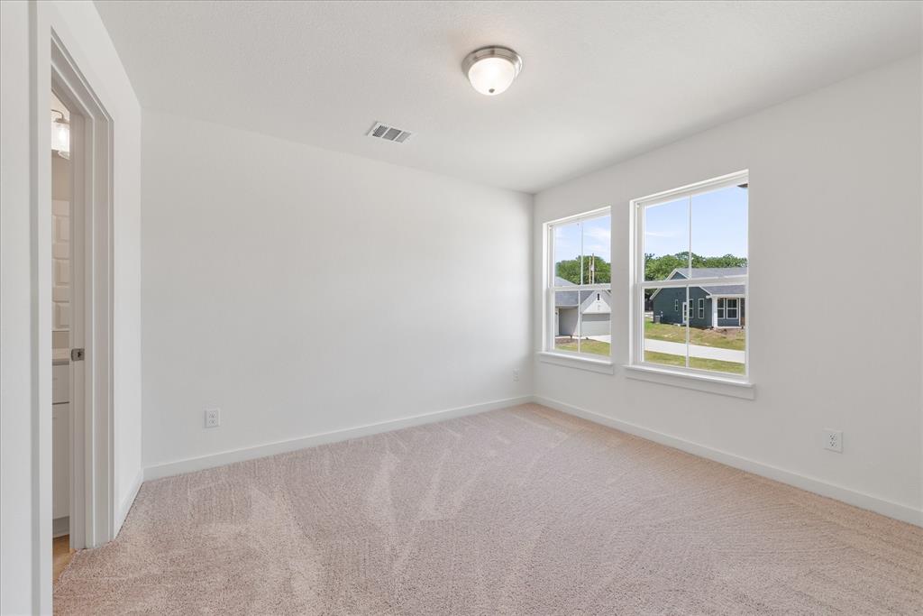 1210 Chestnut Court, Unit 1 Runaway Bay, TX 76426 - Photo 23 of 29 an empty room with windows