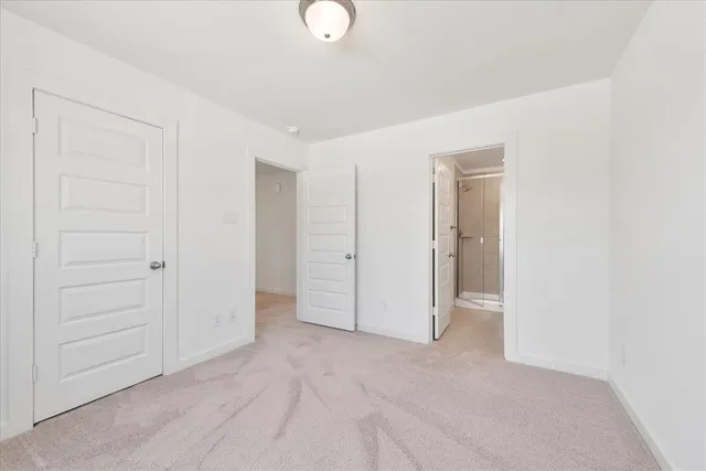an empty room with closet area