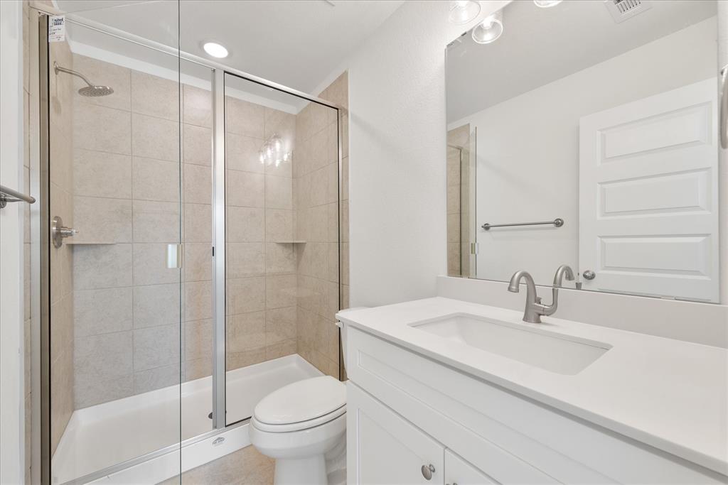 1210 Chestnut Court, Unit 1 Runaway Bay, TX 76426 - Photo 25 of 29 a bathroom with a sink toilet and shower