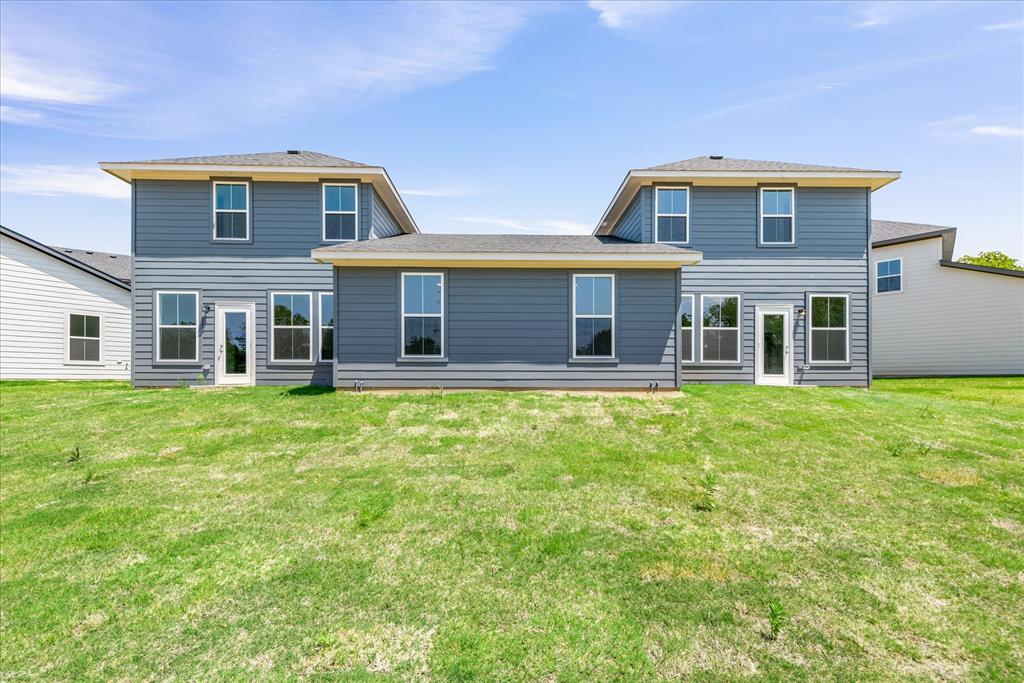 1210 Chestnut Court, Unit 1 Runaway Bay, TX 76426 - Photo 29 of 29 a front view of house with yard