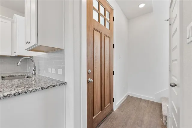a bathroom with a granite countertop sink and a granite top