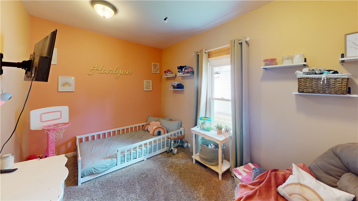 8 Chestnut Street Danville, IL 61832 - Photo 14 of 19 a bedroom with furniture and a window