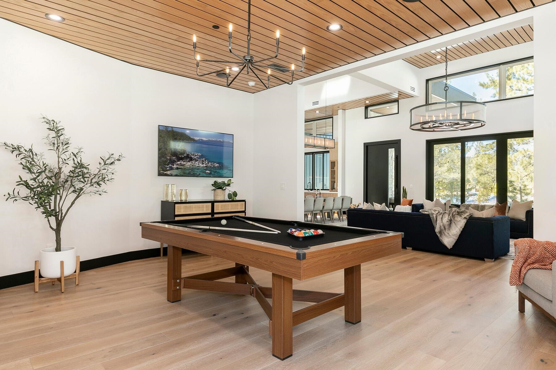 11687 Henness Road Truckee, CA 96161 - Photo 11 of 21 a living room with furniture a table and potted plants