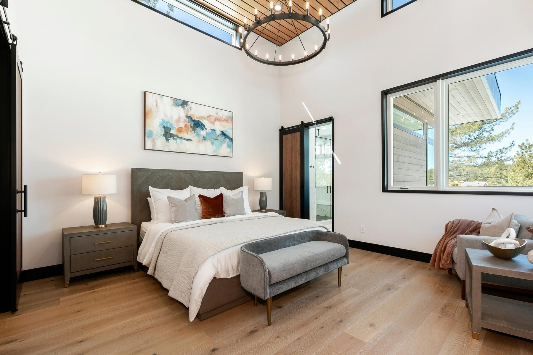 11687 Henness Road Truckee, CA 96161 - Photo 13 of 21 a bedroom with a bed and wooden floor