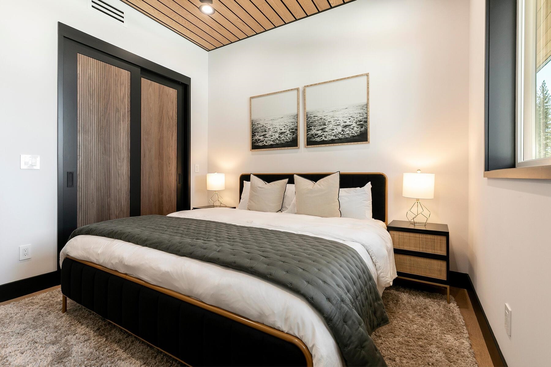 11687 Henness Road Truckee, CA 96161 - Photo 15 of 21 a bedroom with a bed and a painting on the wall