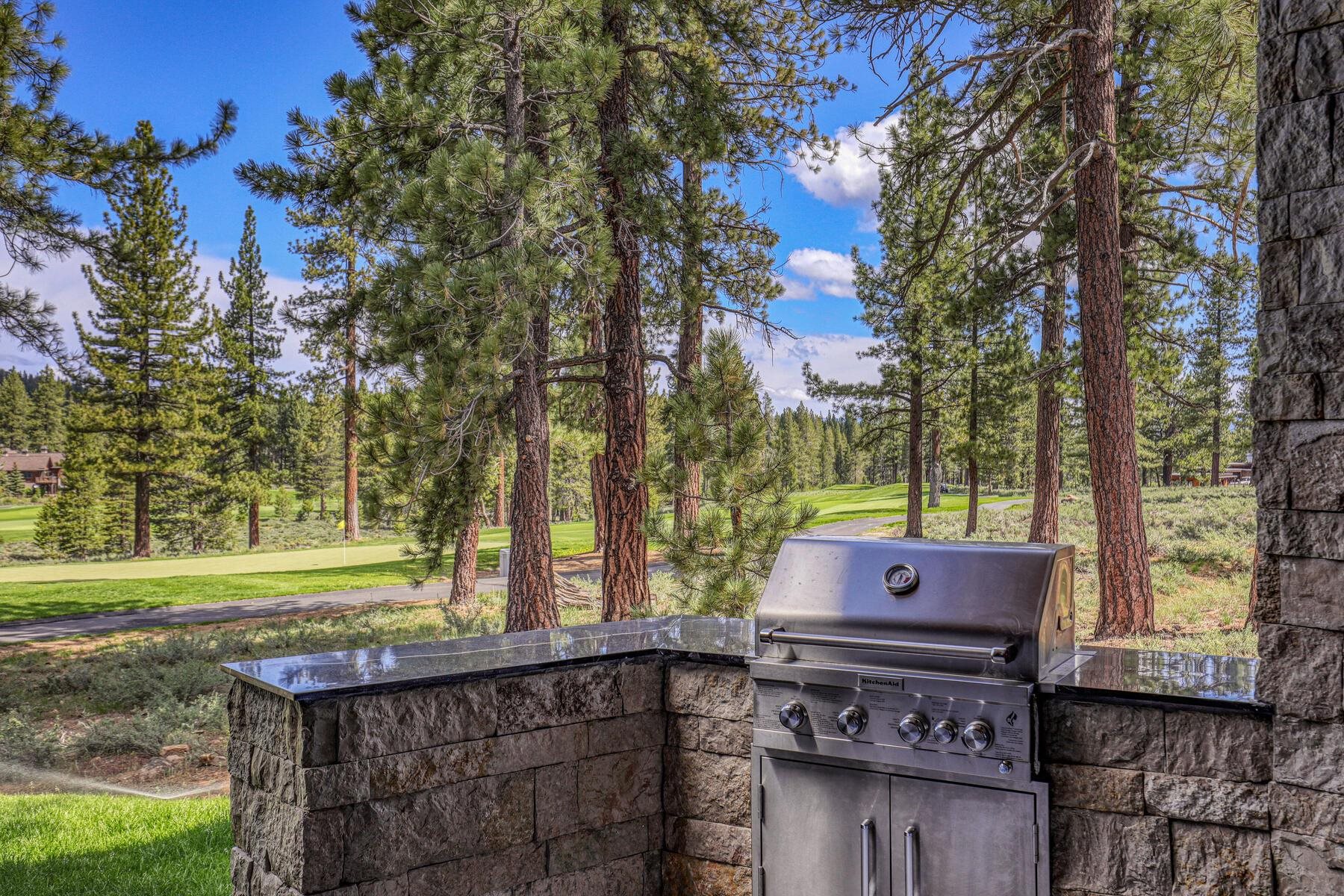 11687 Henness Road Truckee, CA 96161 - Photo 2 of 21 a backyard of a house with a yard and outdoor seating