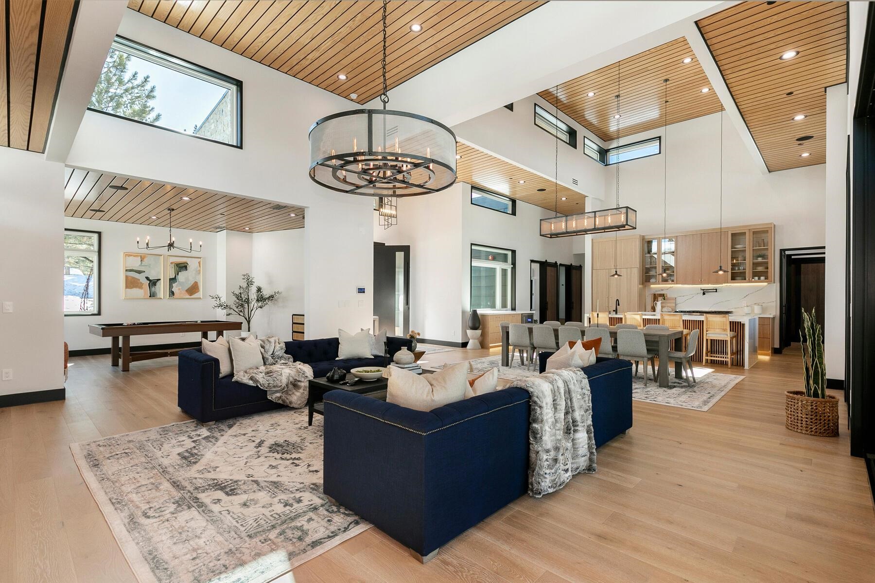 11687 Henness Road Truckee, CA 96161 - Photo 4 of 21 a living room with fireplace furniture and a chandelier