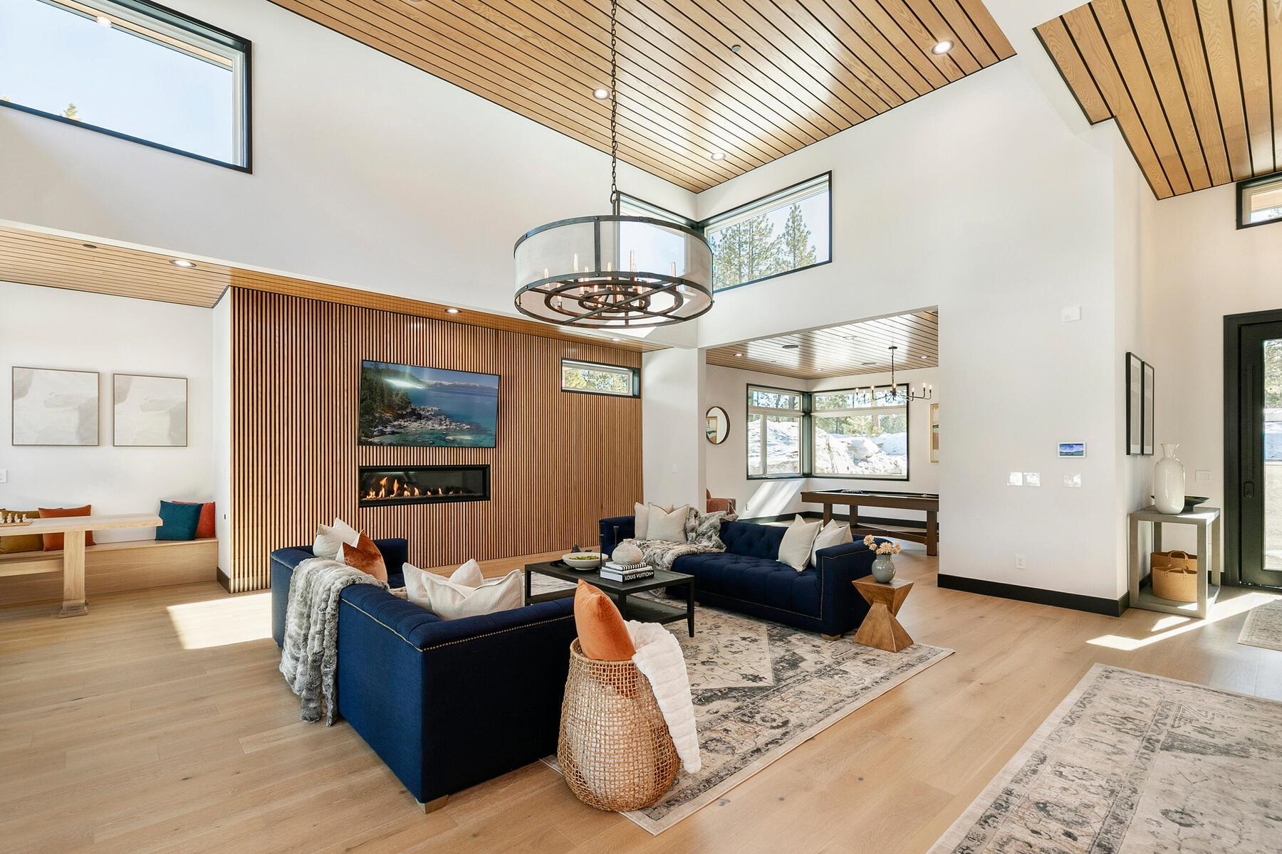 11687 Henness Road Truckee, CA 96161 - Photo 5 of 21 a living room with furniture and a chandelier