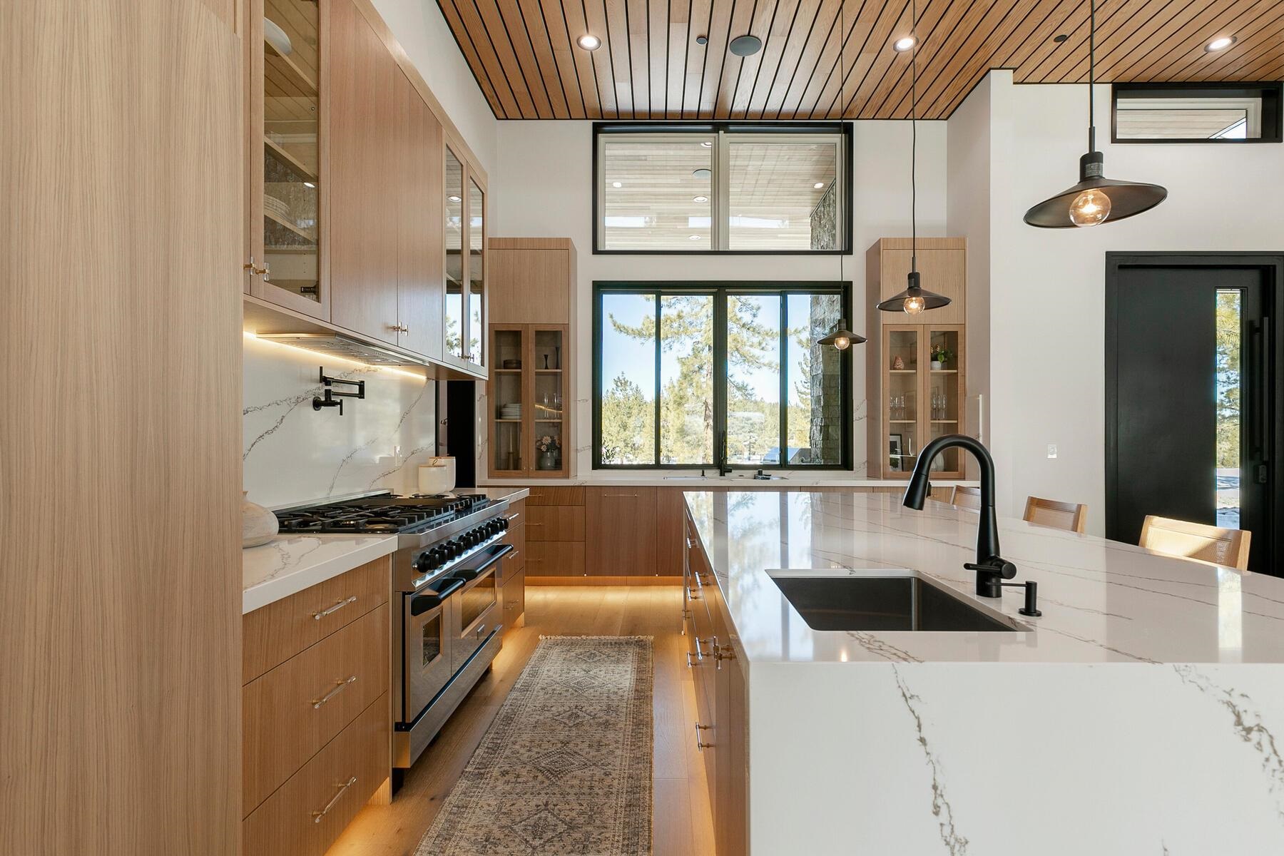 11687 Henness Road Truckee, CA 96161 - Photo 7 of 21 a kitchen with stainless steel appliances granite countertop a stove and a sink