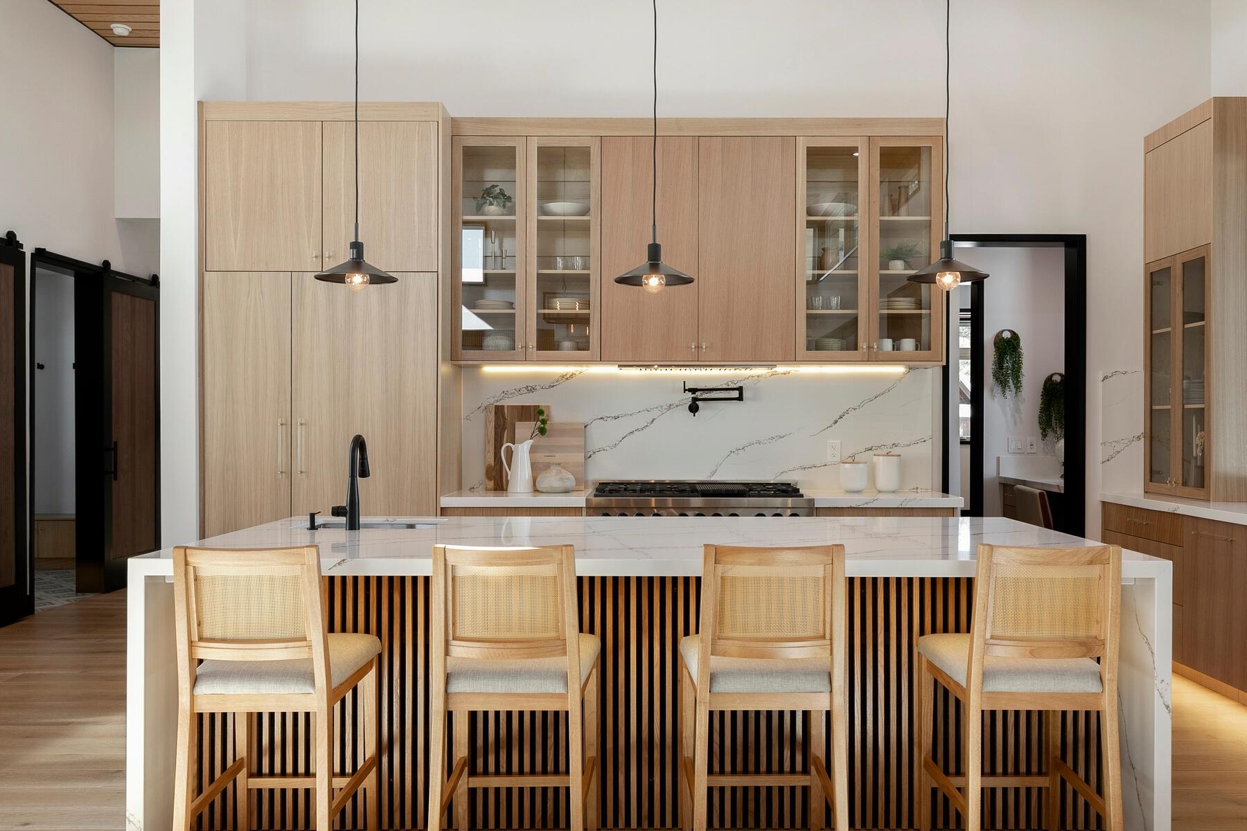 11687 Henness Road Truckee, CA 96161 - Photo 9 of 21 a kitchen with kitchen island granite countertop a refrigerator a stove and a sink with wooden floor