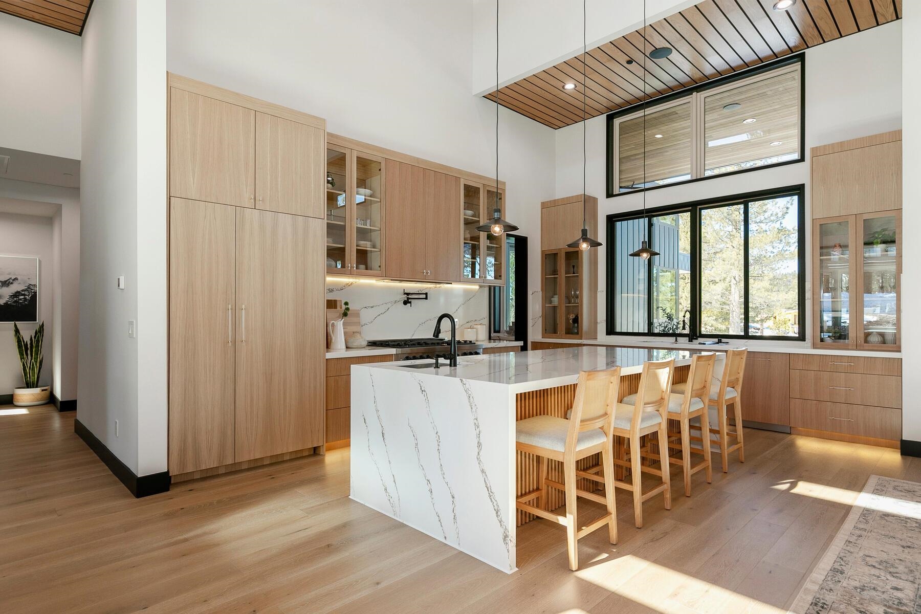 11687 Henness Road Truckee, CA 96161 - Photo 10 of 21 a kitchen with stainless steel appliances kitchen island granite countertop a refrigerator and cabinets