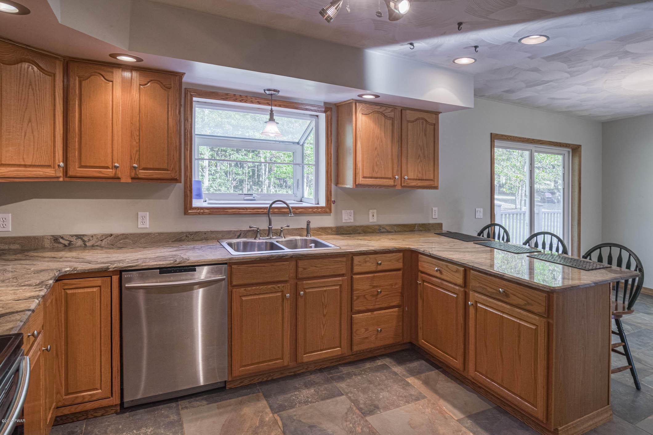 424 Old Gravity Road Lake Ariel, PA 18436 - Photo 7 of 46 a kitchen with a sink stove and cabinets