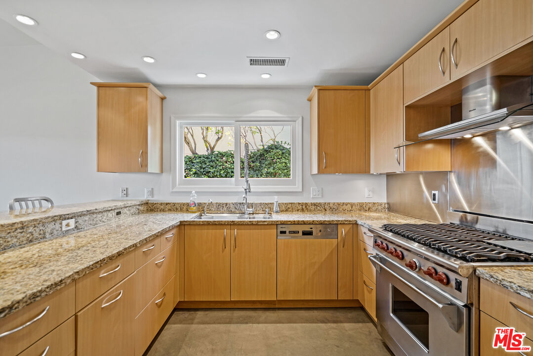 3444 Cloudcroft Drive Malibu, CA 90265 - Photo 15 of 50 a kitchen with a sink stove and microwave