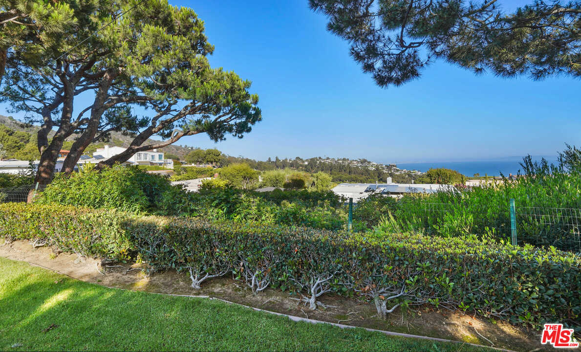 3444 Cloudcroft Drive Malibu, CA 90265 - Photo 18 of 50 a view of a garden with a house