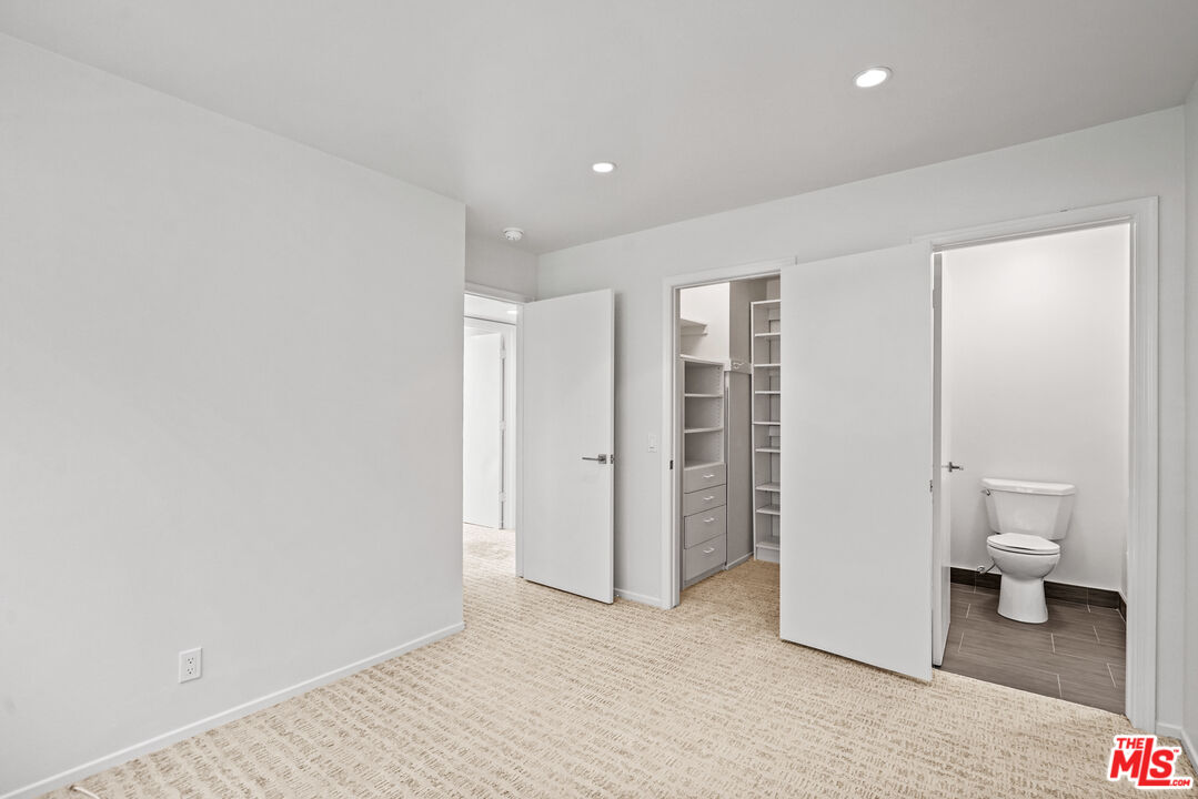 3444 Cloudcroft Drive Malibu, CA 90265 - Photo 31 of 50 a bathroom with a toilet and a walk in closet