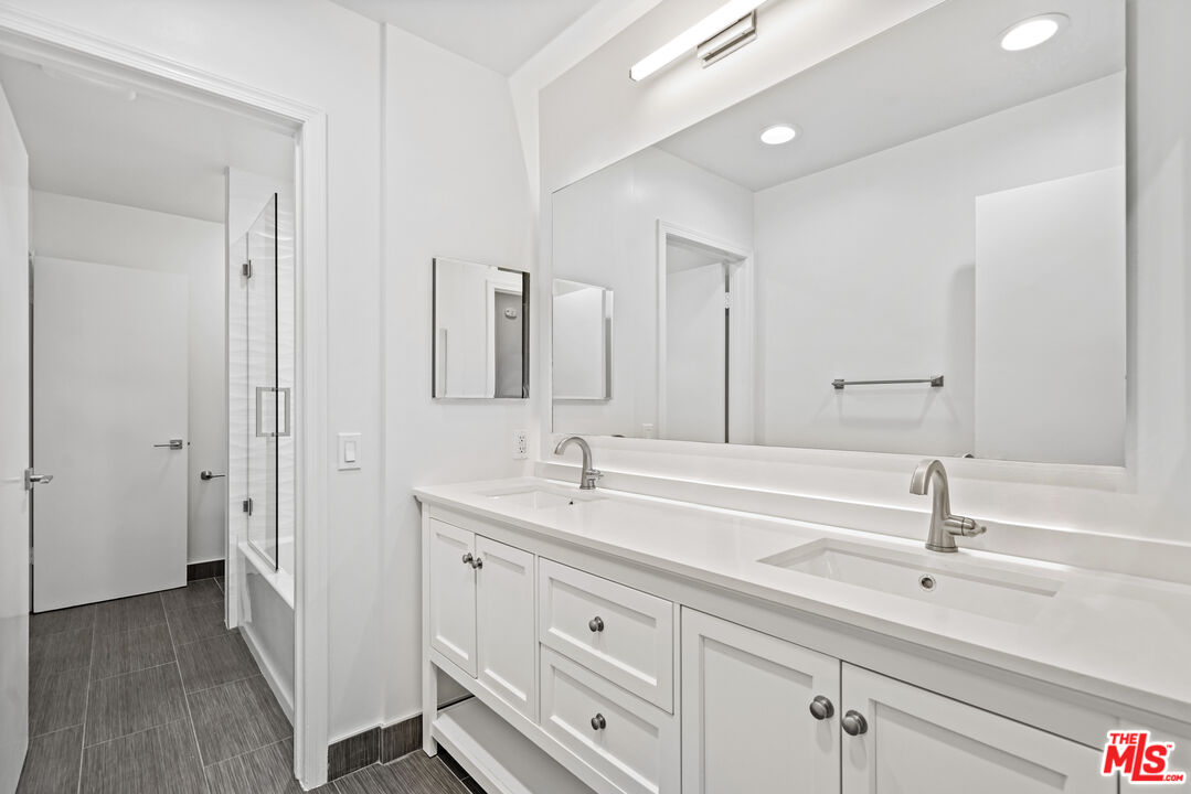 3444 Cloudcroft Drive Malibu, CA 90265 - Photo 34 of 50 a bathroom with a double vanity sink mirror and
