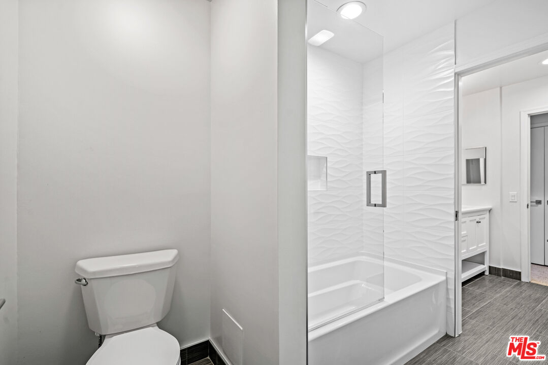 3444 Cloudcroft Drive Malibu, CA 90265 - Photo 35 of 50 a bathroom with a sink a toilet and bathtub