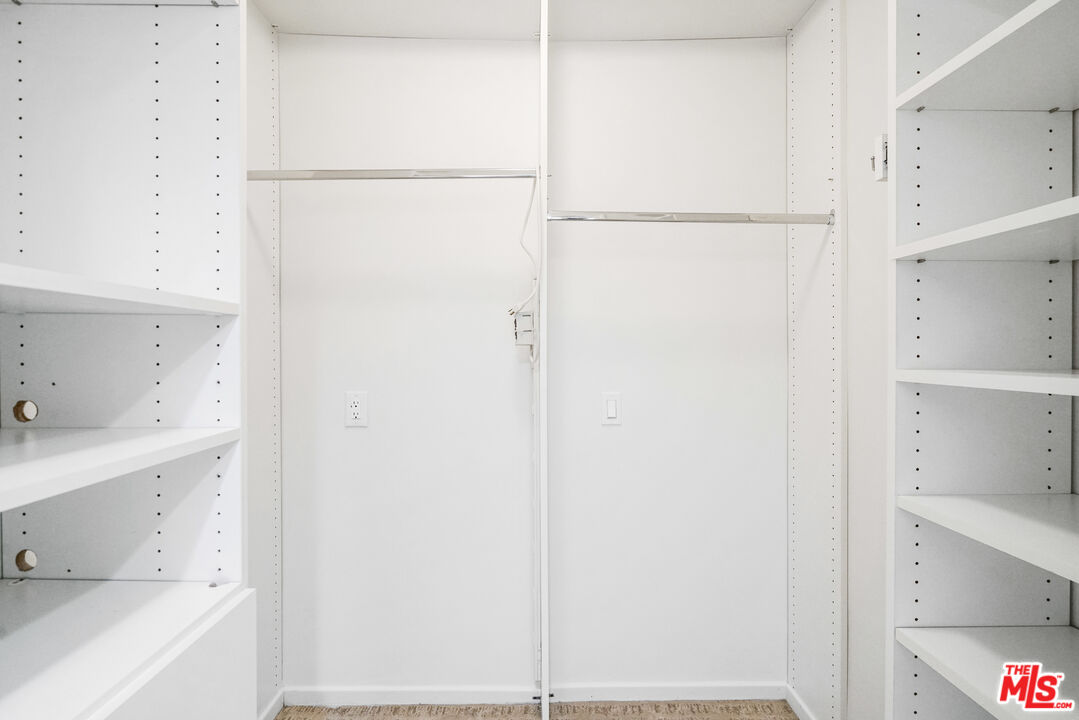 3444 Cloudcroft Drive Malibu, CA 90265 - Photo 37 of 50 a view of walk in closet with empty racks