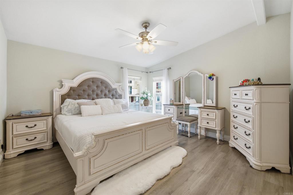 8545 Mission Gorge Road, Unit SPC #147 Santee, CA 92071 - Photo 26 of 43 a bedroom with a bed and a chandelier