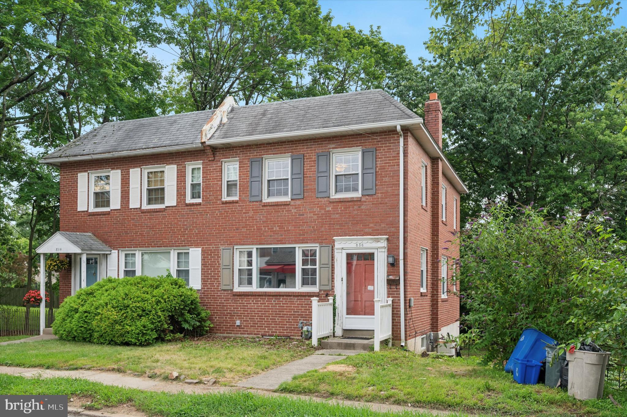 856 North Providence Road Media, PA 19063 - Photo 2 of 25 a front view of a house with a yard