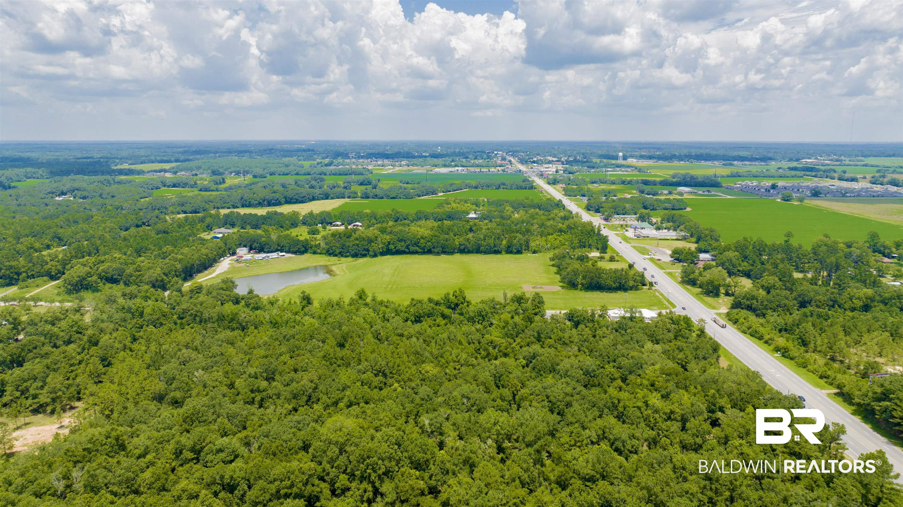 0 Vaughn Road Summerdale, AL 36580 - Photo 4 of 9 Drone / aerial view of a nearby body of water and a forest