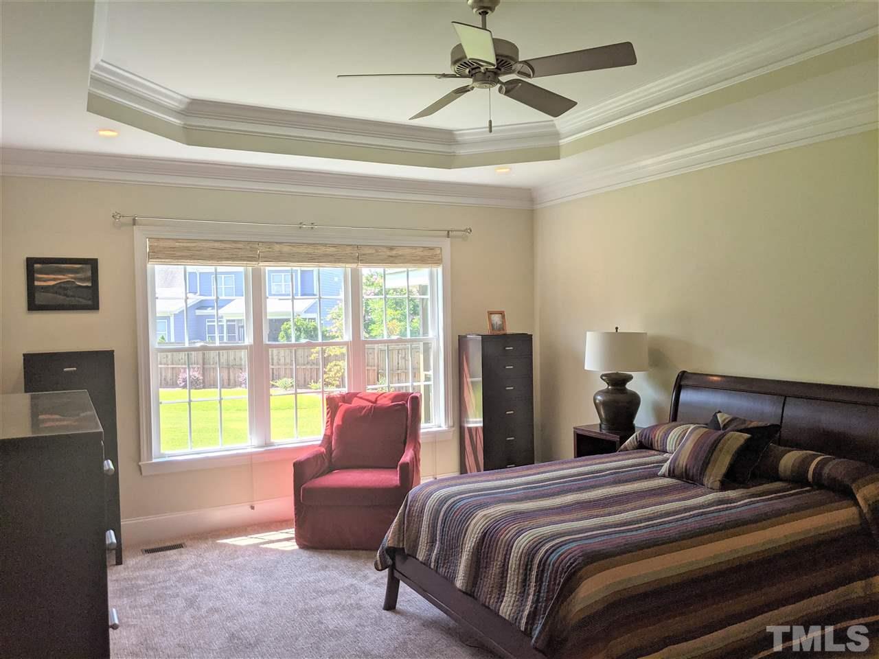 2729 Howard Road Raleigh, NC 27613 - Photo 12 of 26 a bedroom with a bed and a couch