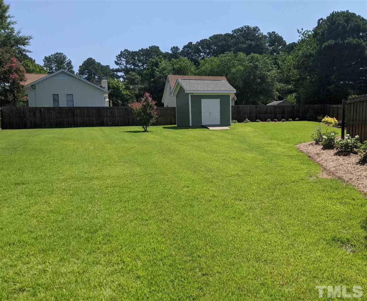 2729 Howard Road Raleigh, NC 27613 - Photo 22 of 26 a front view of a house with garden