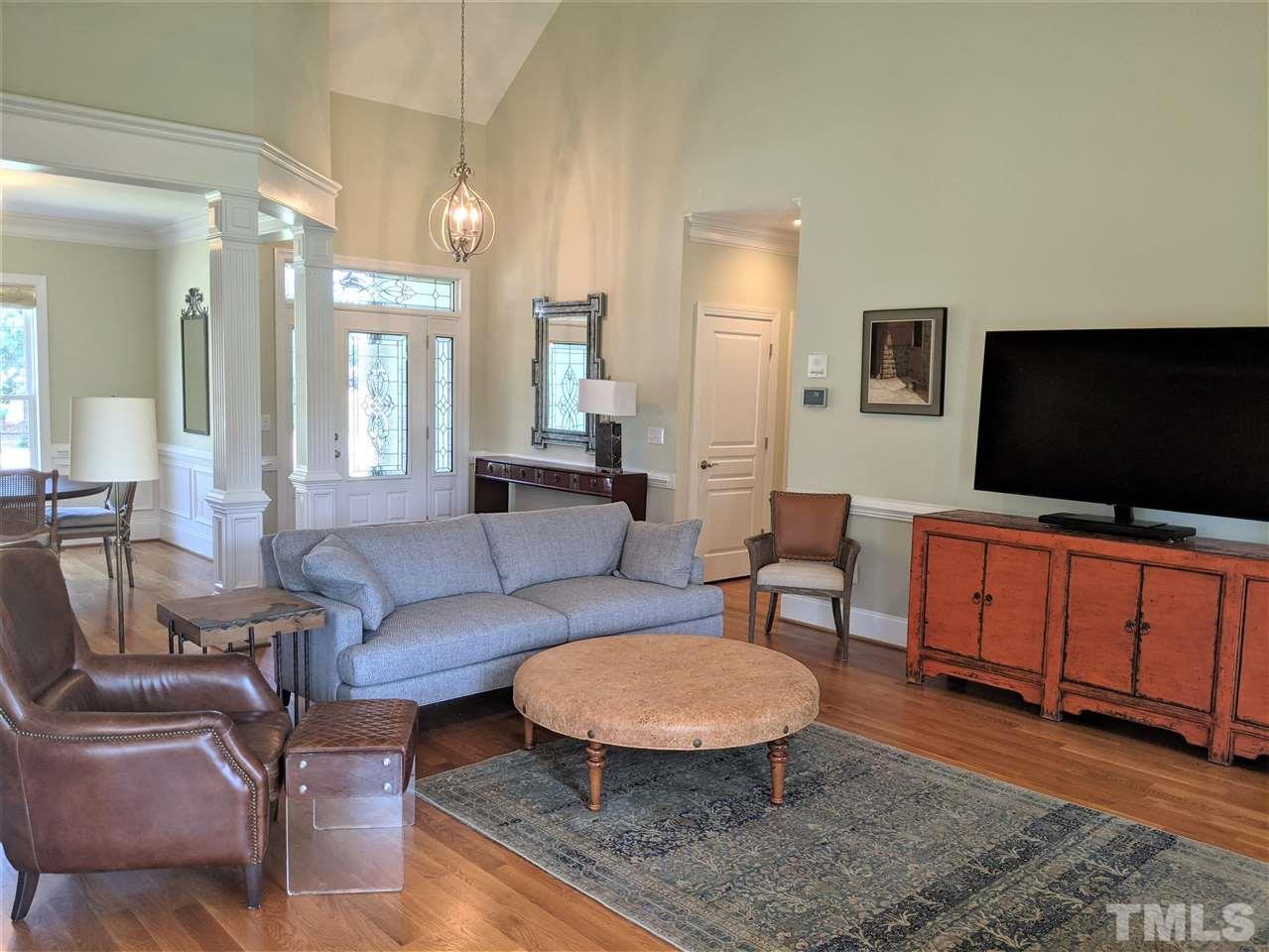 2729 Howard Road Raleigh, NC 27613 - Photo 4 of 26 a living room with furniture and a flat screen tv