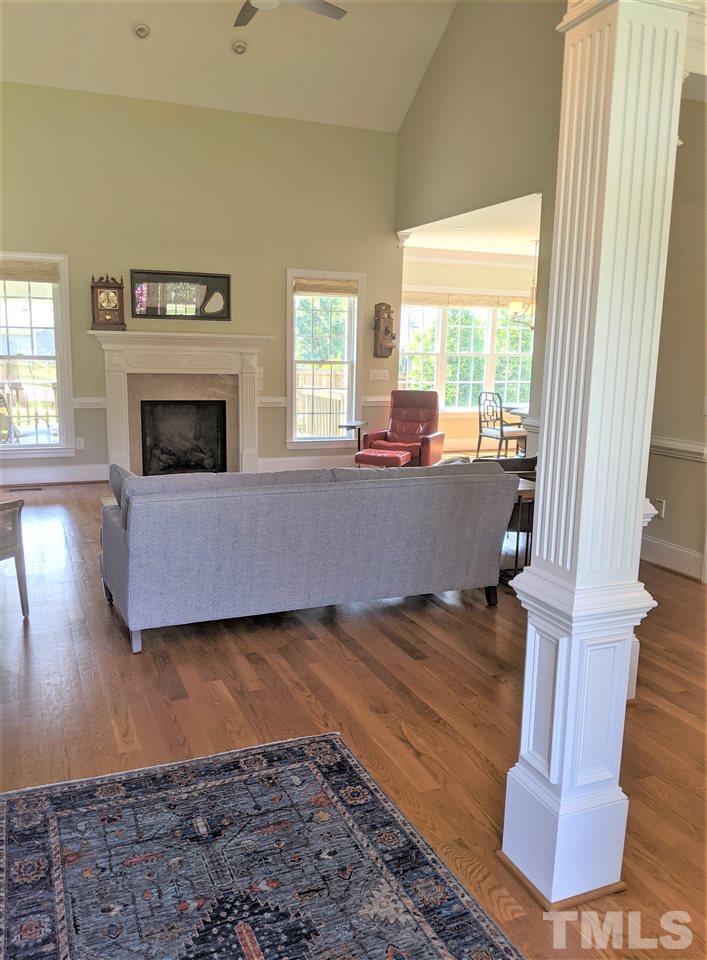 2729 Howard Road Raleigh, NC 27613 - Photo 5 of 26 a living room with furniture and a fireplace