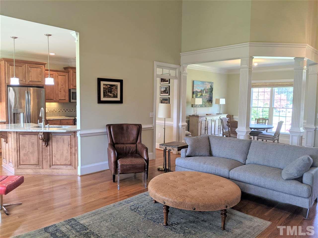 2729 Howard Road Raleigh, NC 27613 - Photo 7 of 26 a living room with furniture and a wooden floor