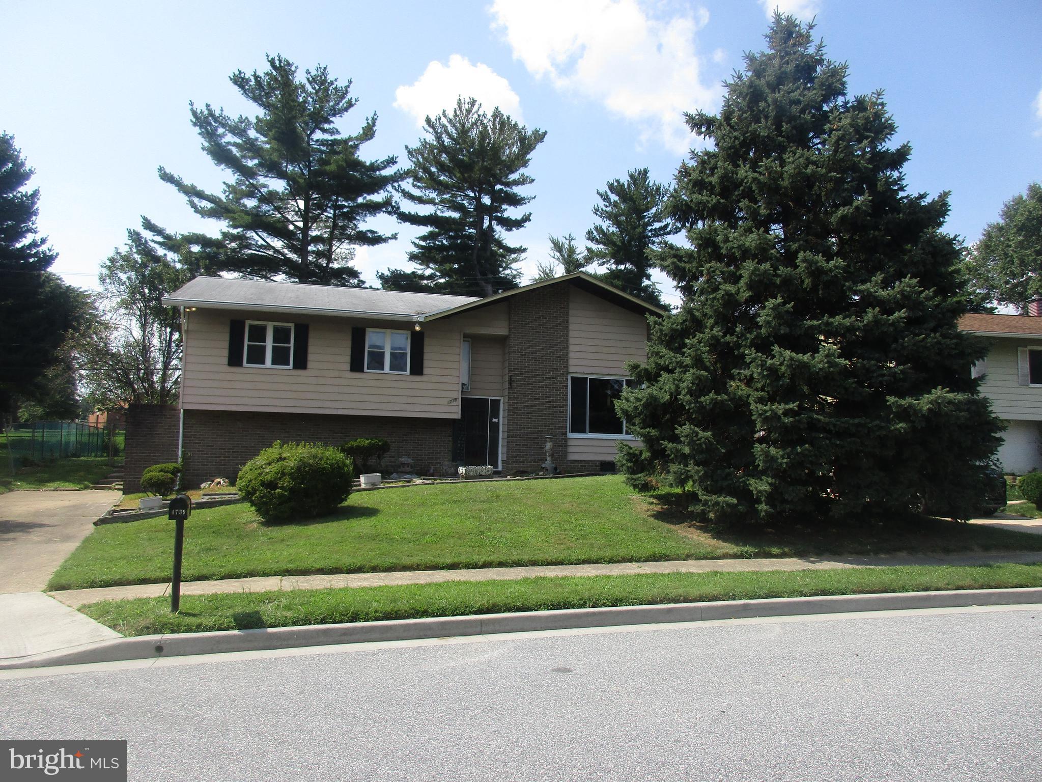 4739 Maryknoll Road Baltimore, MD 21208 - Photo 3 of 42 a house that has a tree in front of it