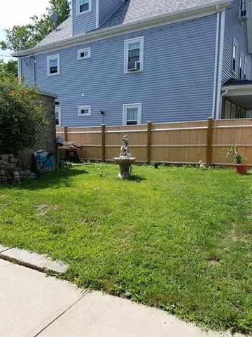 a view of a garden with an outdoor space