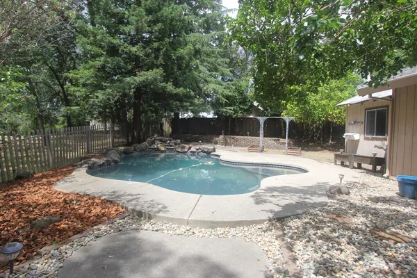 a view of a swimming pool with a patio