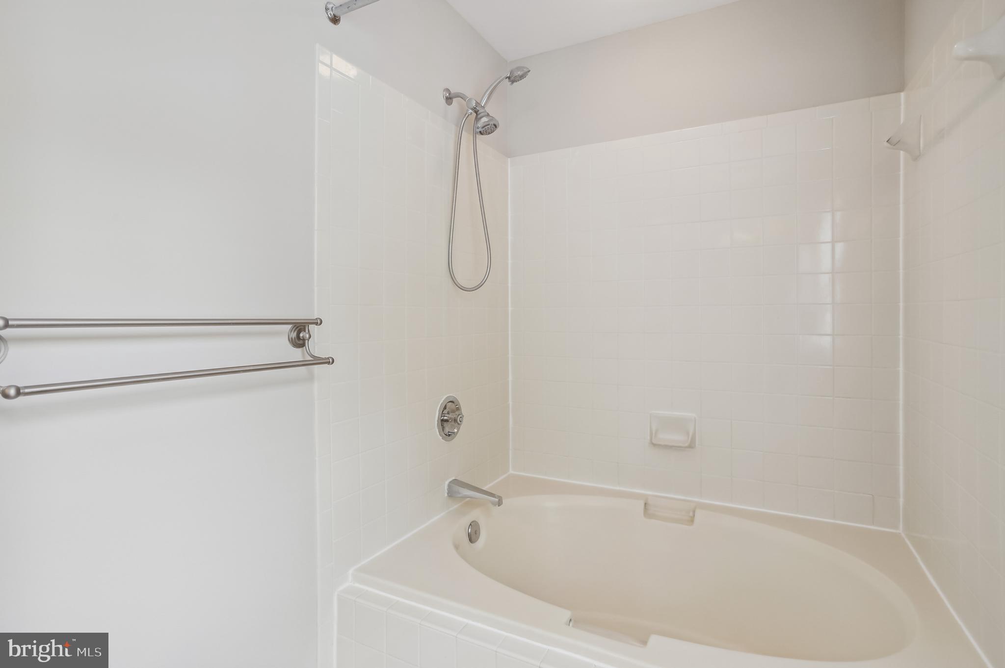 735 Evergreen Road Severn, MD 21144 - Photo 28 of 47 a bathroom with a shower and a bath tub
