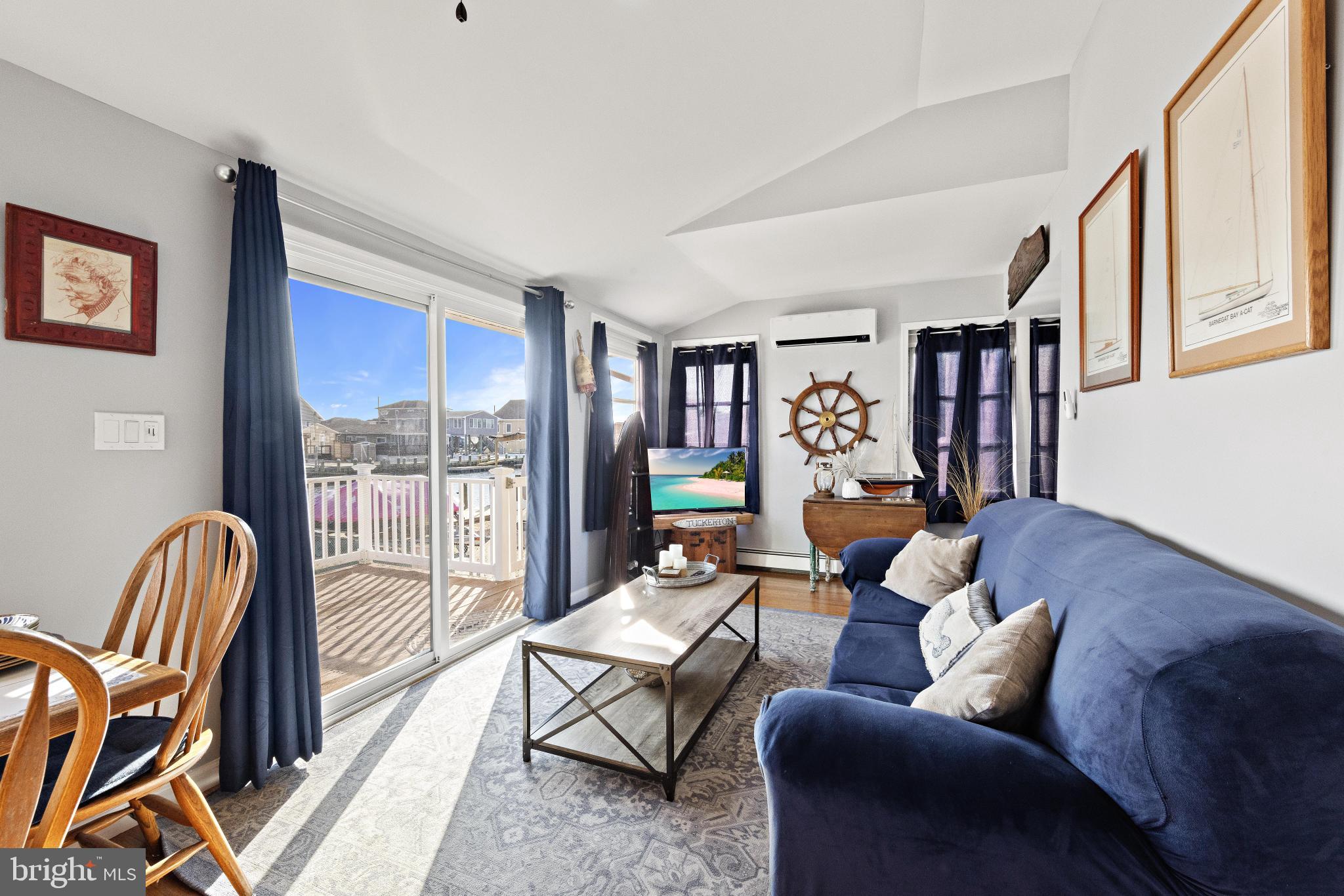 79 Dolphin Road Tuckerton, NJ 08087 - Photo 12 of 53 a living room with furniture and a floor to ceiling window